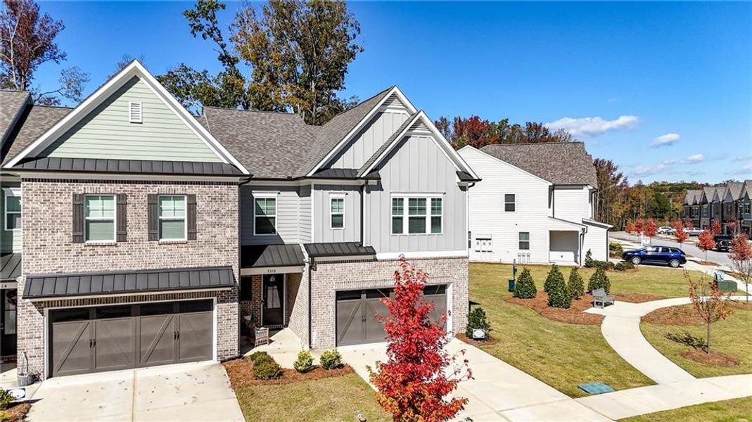Front exterior of a new home in , Flowery Branch, GA, highlighting curb appeal (Image 2).