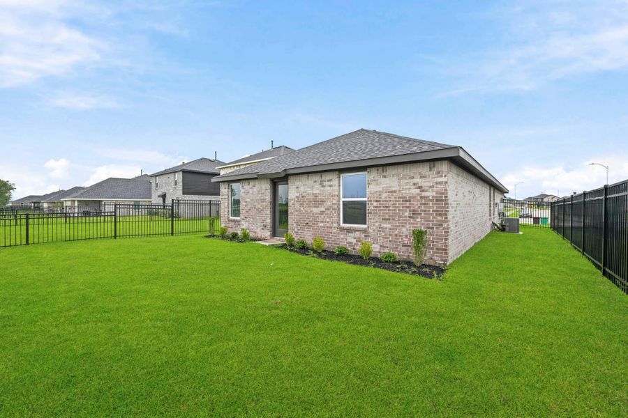 Exterior details and patio area of a home in Sunterra, Katy (Image 23).