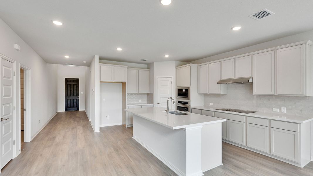 Furnished interior view inside a new home in Oaks at San Gabriel, Georgetown (Image 4).
