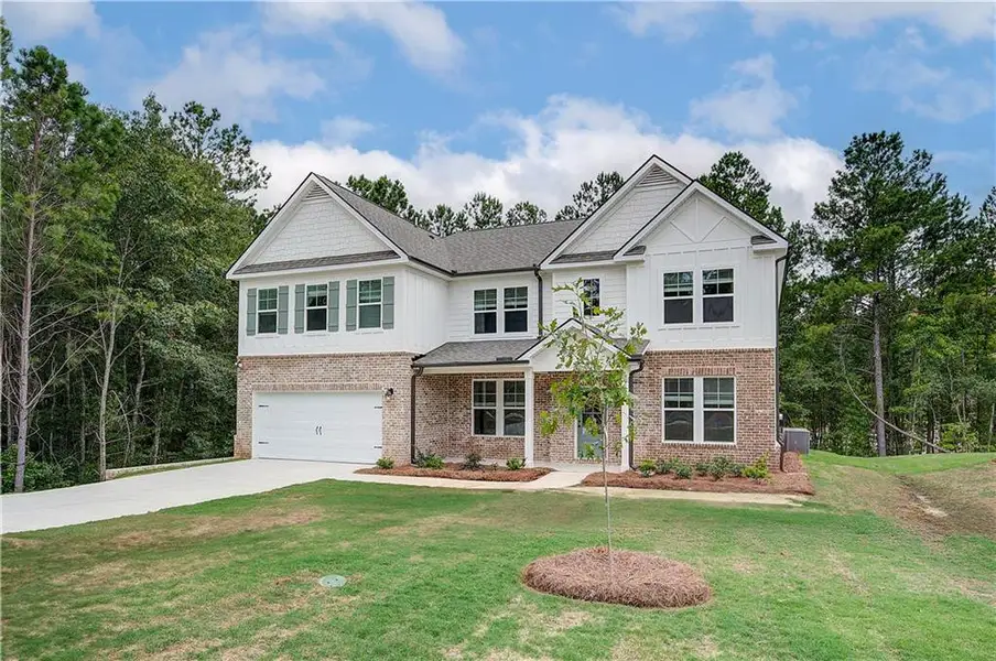 Front exterior of a new home in Kingston, Locust Grove, GA, highlighting curb appeal (Image 17).