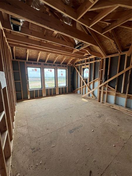 Spacious upstairs gameroom with tons of natural lighting seeping through oversized windows!