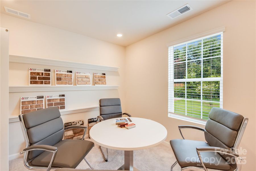 This is a first floor guest bedroom ( formerly being used as a design sample area). Shelving has been removed.