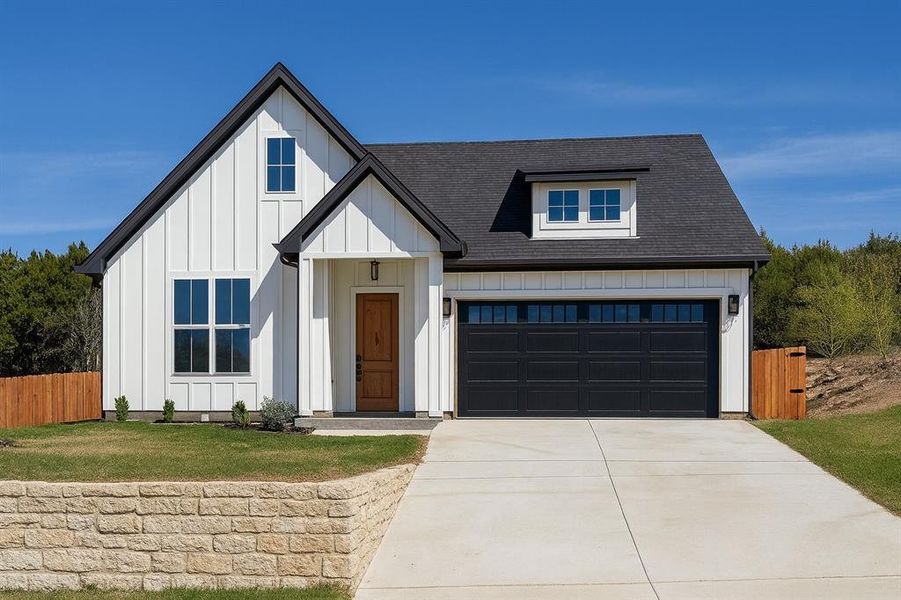 Modern inspired farmhouse with board and batten siding, roof with shingles, and concrete driveway Modern inspired farmhouse with board and batten siding, roof with shingles, and concrete driveway