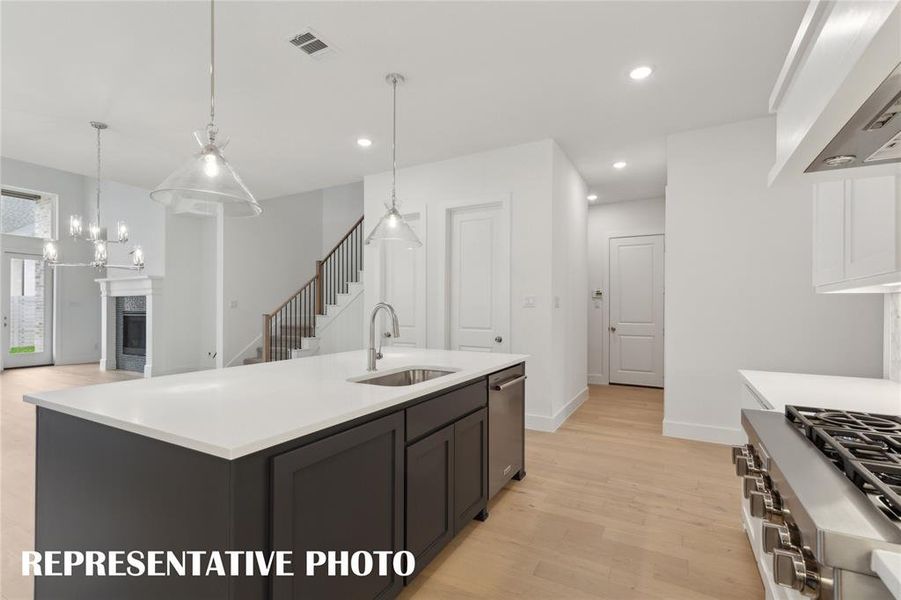 Featuring a perfectly designed open concept floor plan, the chef will never be left out of the party in our Justin floor plan!  REPRESENTATIVE PHOTO