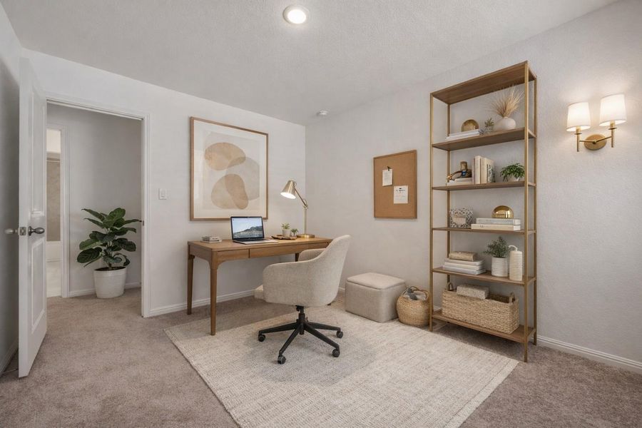 Office with light carpet and baseboards