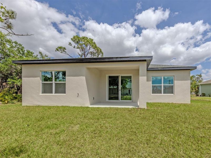 Exterior details and patio area of a home in , North Port (Image 23).