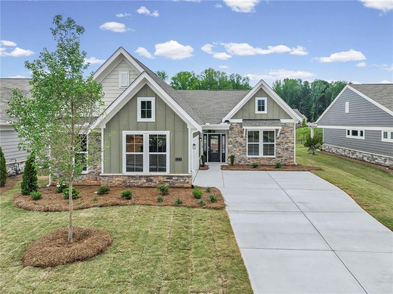 Front exterior of a new home in Laurel Farms, Dallas, GA, highlighting curb appeal (Image 21). Front exterior of a new home in Laurel Farms, Dallas, GA, highlighting curb appeal (Image 21).
