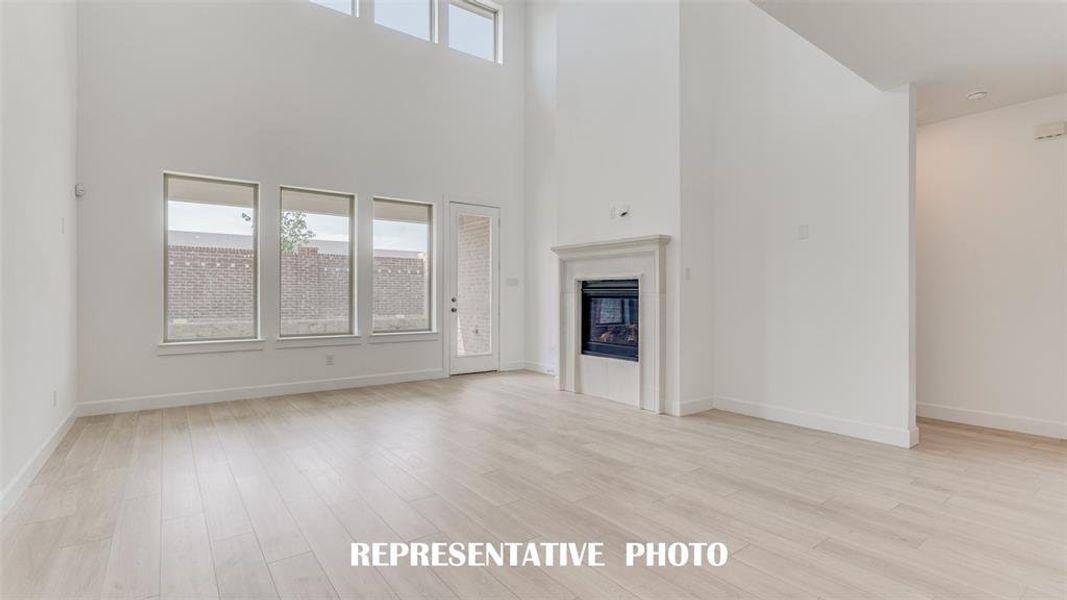 You'll find a family room filled with natural light from a wonderful wall of windows in our Provence plan!  REPRESENTATIVE PHOTO.