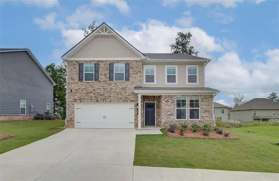 Front exterior of a new home in Westminster, Covington, GA, highlighting curb appeal (Image 14).