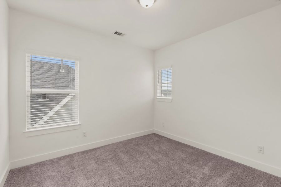 Representative unfurnished interior of a home built from the St Andrews by Chesmar Homes in Riceland Alley Loads, Mont Belvieu (Image 66).
