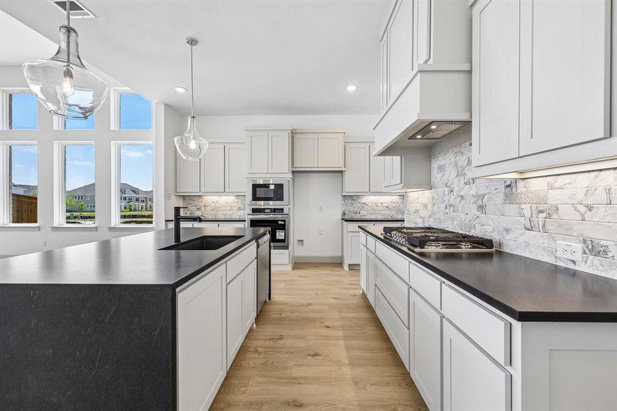 Beautiful cabinetry, gorgeous counter tops and classic backsplash effortlessly pair with contemporary stainless steel to create a kitchen for the ages! Beautiful cabinetry, gorgeous counter tops and classic backsplash effortlessly pair with contemporary stainless steel to create a kitchen for the ages!