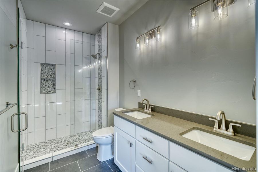 Dual vanity, custom tile shower
