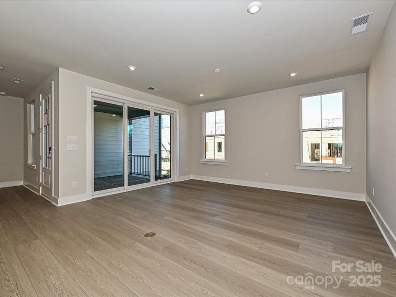 Large great room highlighted by 9' wide sliding glass doors.