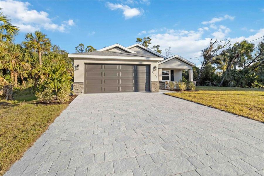 Front exterior of a new home in , North Port, FL, highlighting curb appeal (Image 24). Front exterior of a new home in , North Port, FL, highlighting curb appeal (Image 24).