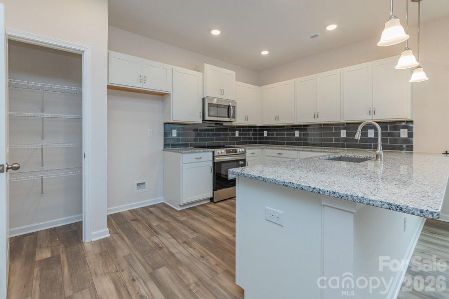 Furnished interior view inside a new home in Country Club Village, Salisbury (Image 4).