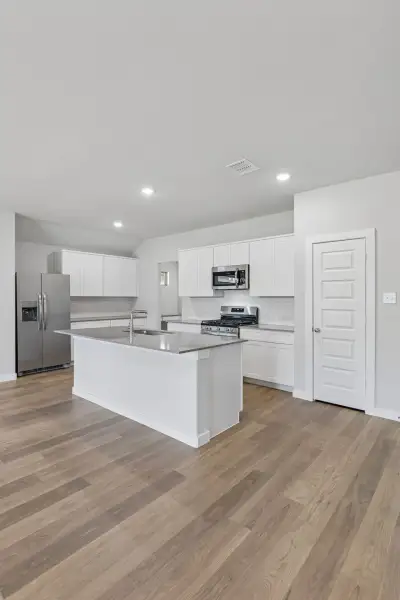 Kitchen in the Harrison home plan by Trophy Signature Homes – REPRESENTATIVE PHOTO Kitchen in the Harrison home plan by Trophy Signature Homes – REPRESENTATIVE PHOTO
