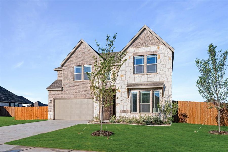 Front exterior of a new home in Coyote Crossing, Godley, TX, highlighting curb appeal (Image 2).