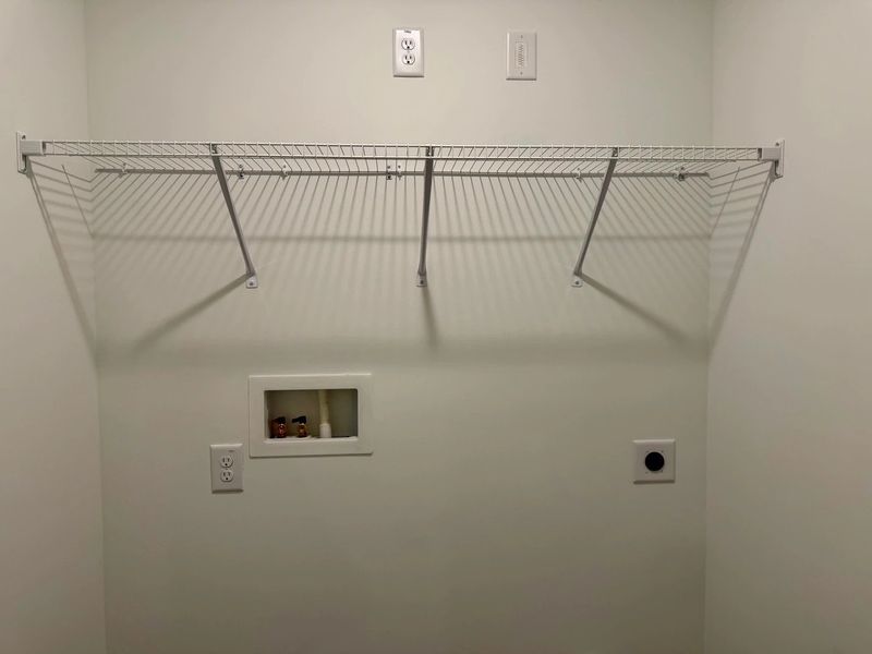 Laundry Room - Functional with flair, featuring sleek shelving.
