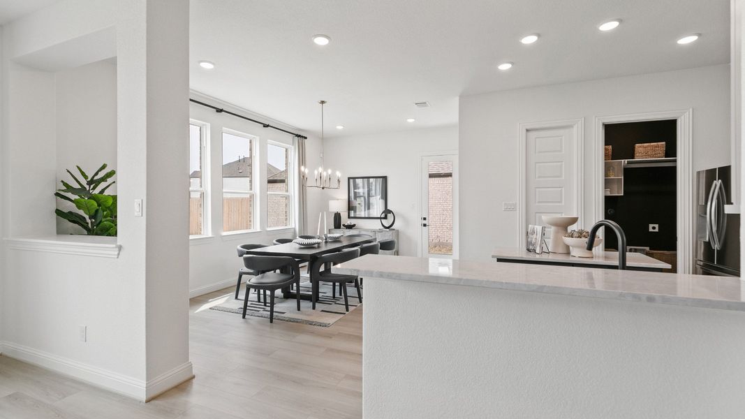 Representative furnished interior of a home built from the Mimosa by Brightland Homes in Sunterra, Katy (Image 12).