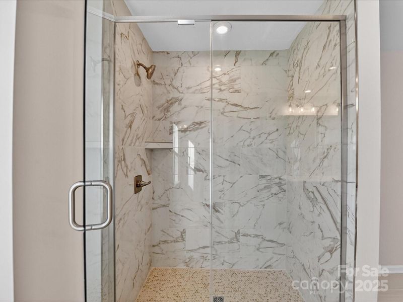 Primary Tiled Walk-In Shower.