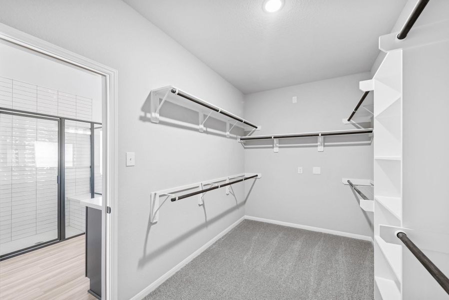 Primary walk-in closet Primary walk-in closet