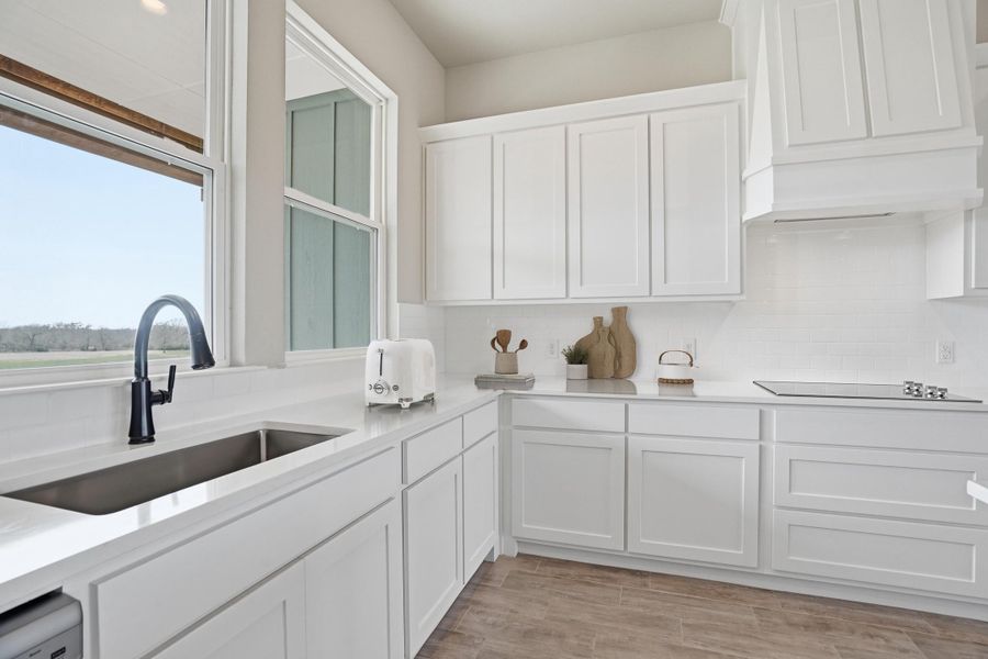 Representative furnished interior of a home built from the The Petunia by Kenmark Homes in Zion Valley, Poolville (Image 4).