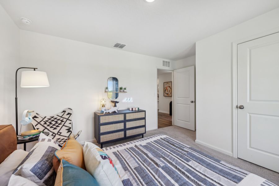 A living room with a rug and a couch.