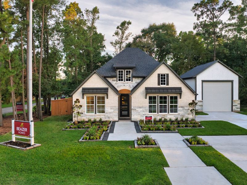 Front exterior of a new home in Timber Hollow, Magnolia, TX, highlighting curb appeal (Image 2). Front exterior of a new home in Timber Hollow, Magnolia, TX, highlighting curb appeal (Image 2).