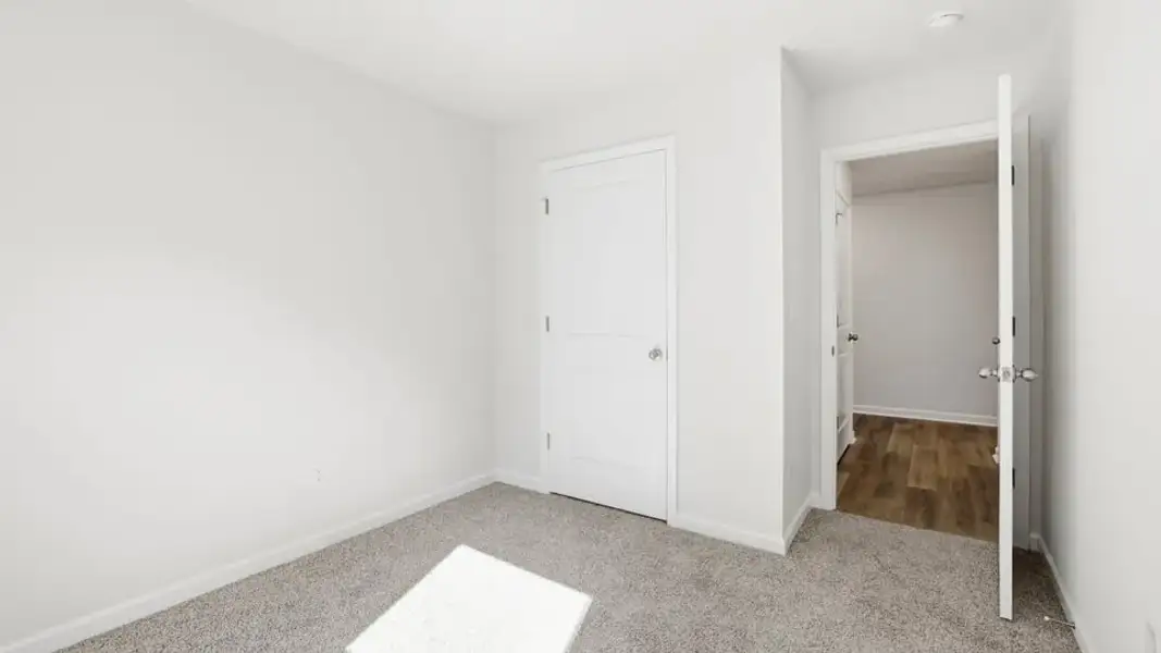 Spacious, unfurnished interior of a new home in Waverly Station, Greenwood (Image 24).