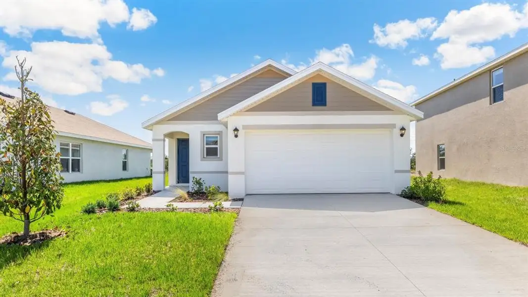 Front exterior of a new home in Oakfield Lakes, Parrish, FL, highlighting curb appeal (Image 2). Front exterior of a new home in Oakfield Lakes, Parrish, FL, highlighting curb appeal (Image 2).