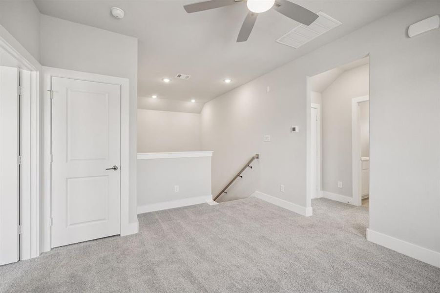 Spare room with light colored carpet, recessed lighting, and a ceiling fan Spare room with light colored carpet, recessed lighting, and a ceiling fan