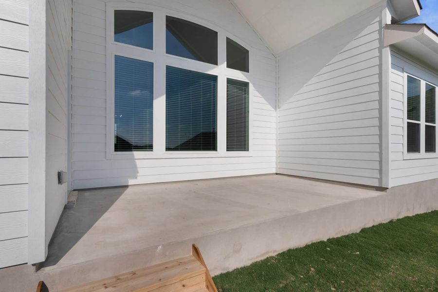 Exterior details and patio area of a home in Lariat, Liberty Hill (Image 17).