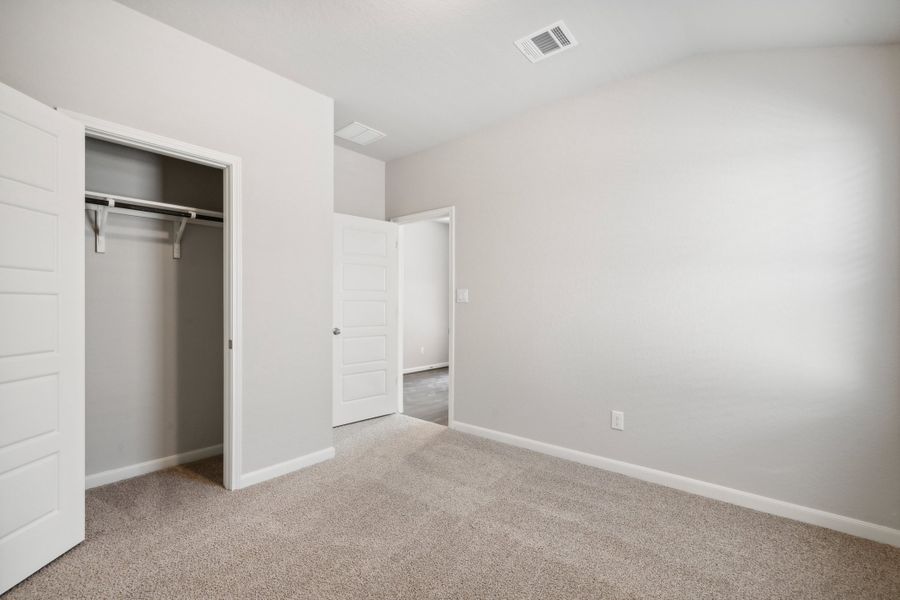 Guest bedroom in the Fitzhugh floorplan in a Meritage Homes community.