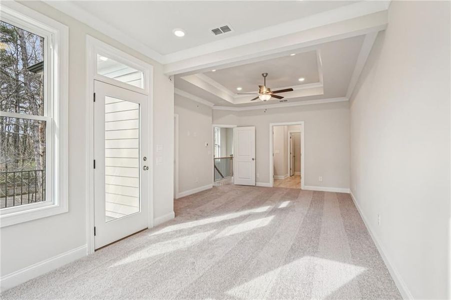 Primary Bedroom retreat- private back wooded views and spa- like bathroom with free-standing tub and large shower.
