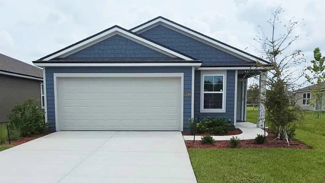 Front exterior of a new home in The Arbors, Jacksonville, FL, highlighting curb appeal (Image 1). Front exterior of a new home in The Arbors, Jacksonville, FL, highlighting curb appeal (Image 1).