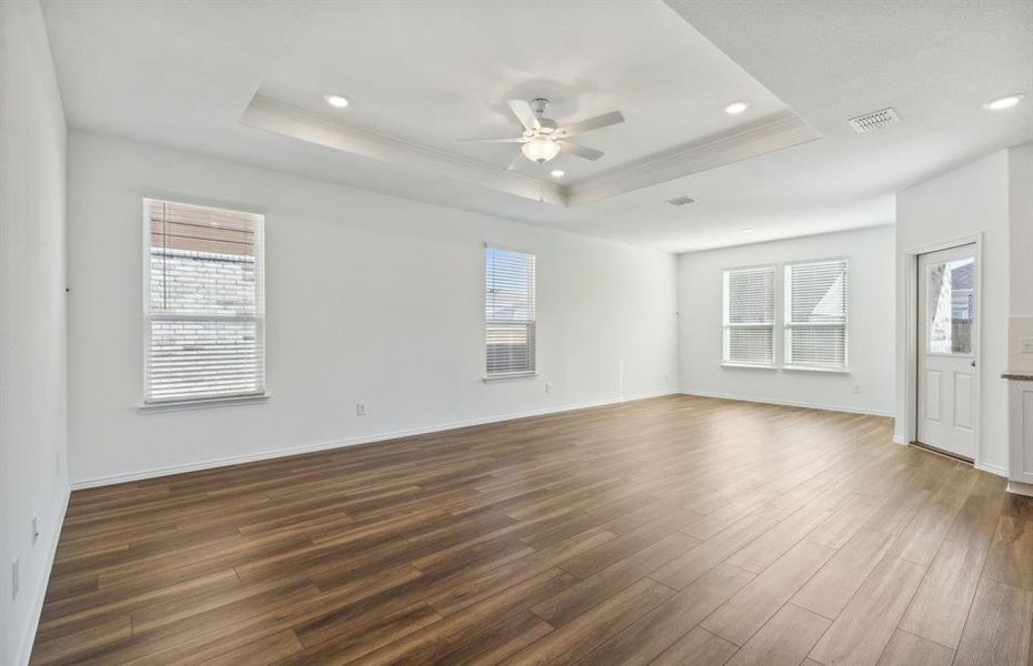 Elegant gathering room with Tray ceiling *real home pictured