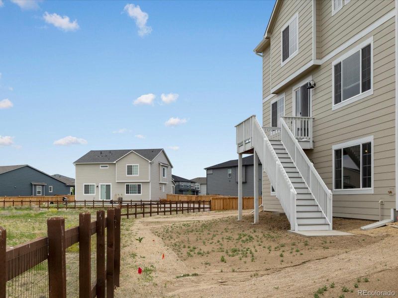 Front exterior of a new home in Buffalo Highlands: The Canyon Collection, Commerce City, CO, highlighting curb appeal (Image 2).