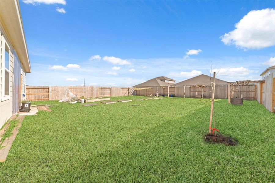 Exterior details and patio area of a home in Sunterra, Katy (Image 4).