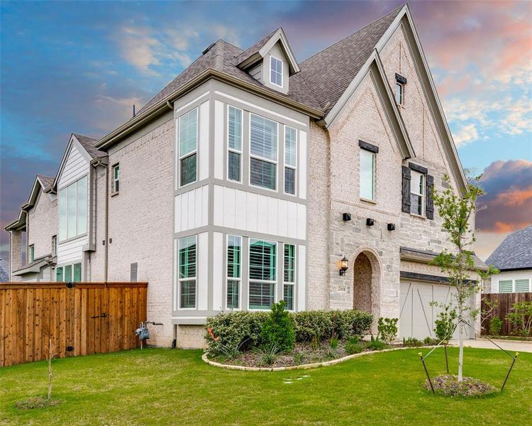 Front exterior of a new home in Grand Braniff Park, Irving, TX, highlighting curb appeal (Image 2). Front exterior of a new home in Grand Braniff Park, Irving, TX, highlighting curb appeal (Image 2).