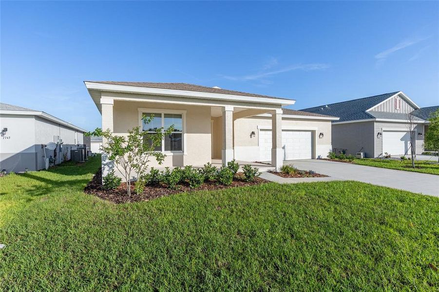 Front exterior of a new home in Calesa Township, Ocala, FL, highlighting curb appeal (Image 19). Front exterior of a new home in Calesa Township, Ocala, FL, highlighting curb appeal (Image 19).