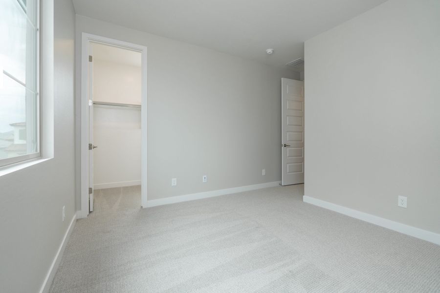 Spacious, unfurnished interior of a new home in Waterston Central, Gilbert (Image 18).