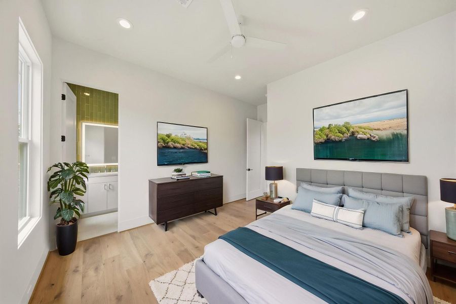 One of the three secondary bedrooms. All bedrooms offer en suite bathroom and walk-in closet *virtually staged.