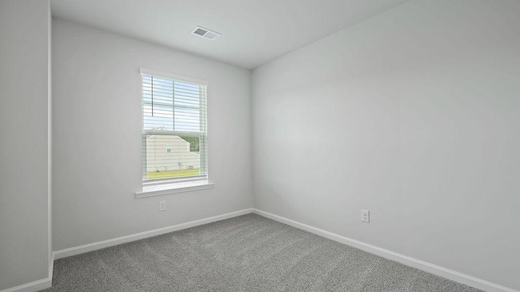 Spacious, unfurnished interior of a new home in Pine Hills Townhomes at Cane Bay, Summerville (Image 19).