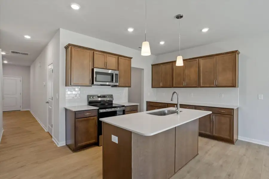 Furnished interior view inside a new home in West Main Townhomes, Sanford (Image 7).