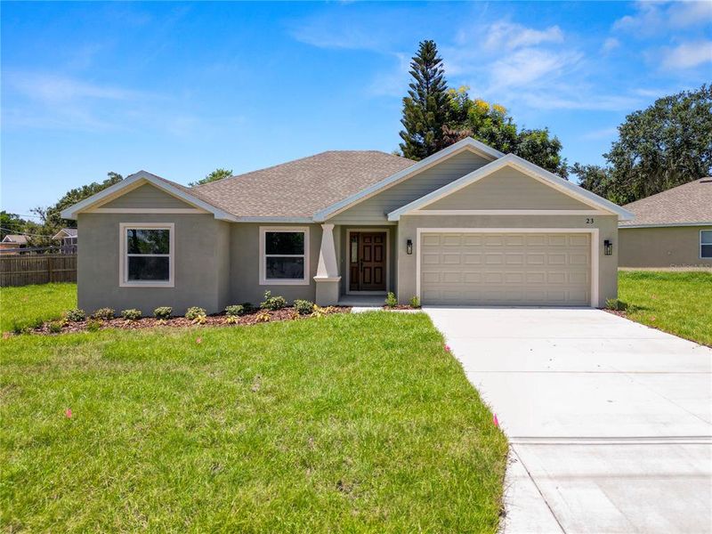 Front exterior of a new home in , Eagle Lake, FL, highlighting curb appeal (Image 25).