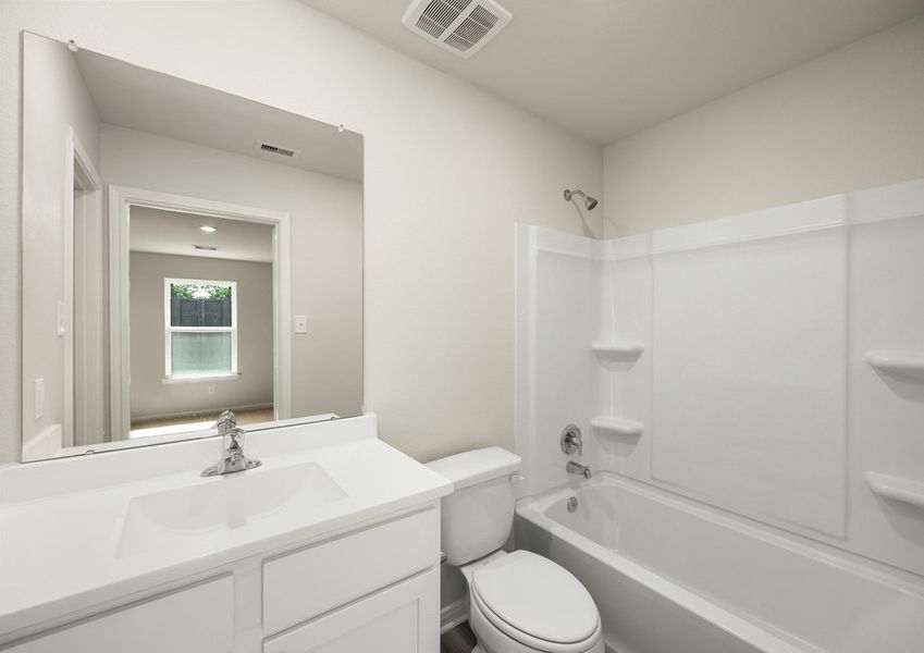 A bathroom with a shower/tub combination A bathroom with a shower/tub combination