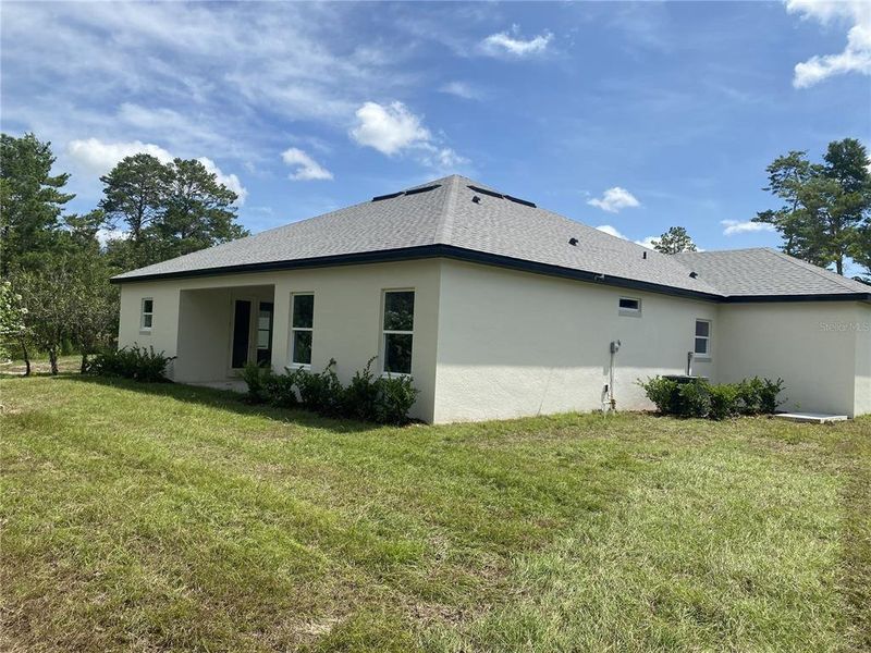 Exterior details and patio area of a home in , Brooksville (Image 4).