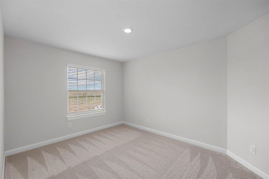 One of the three large upstairs bedrooms.