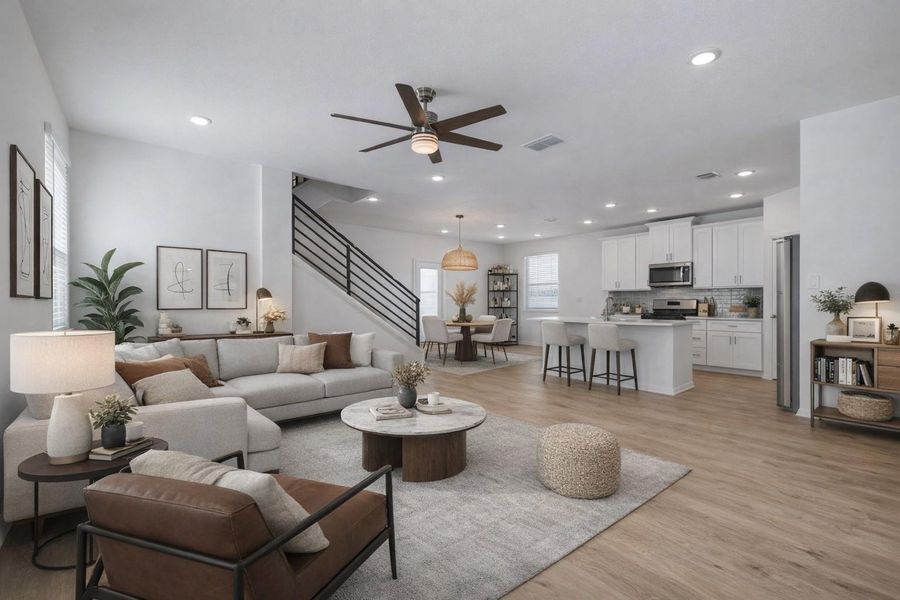 Living room featuring a ceiling fan, light wood-type flooring, and recessed lighting