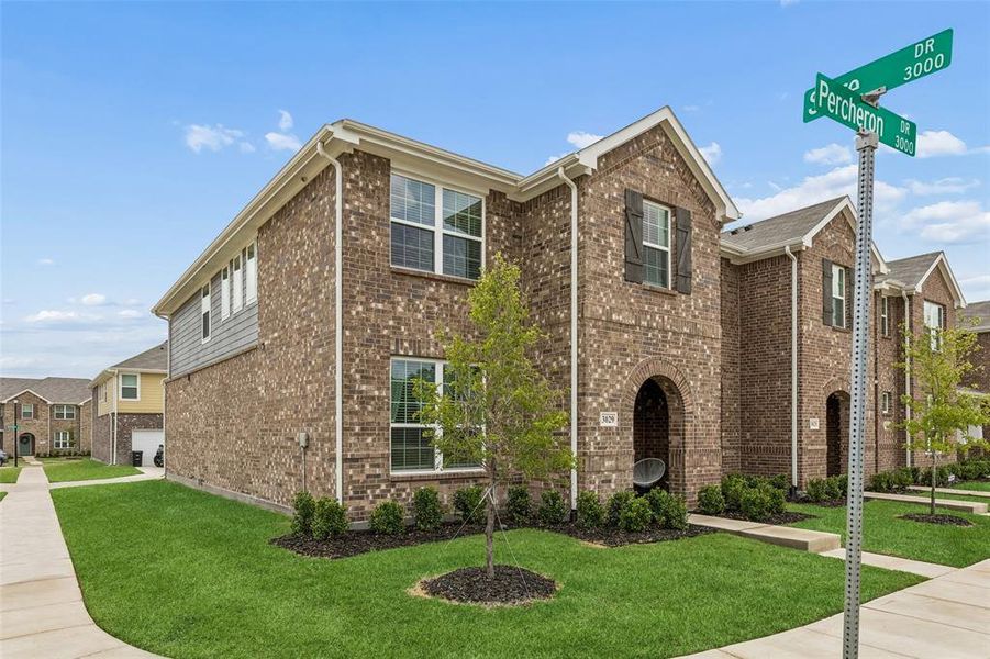 Front exterior of a new home in Cloverleaf Crossing Townhomes, Mesquite, TX, highlighting curb appeal (Image 20).
